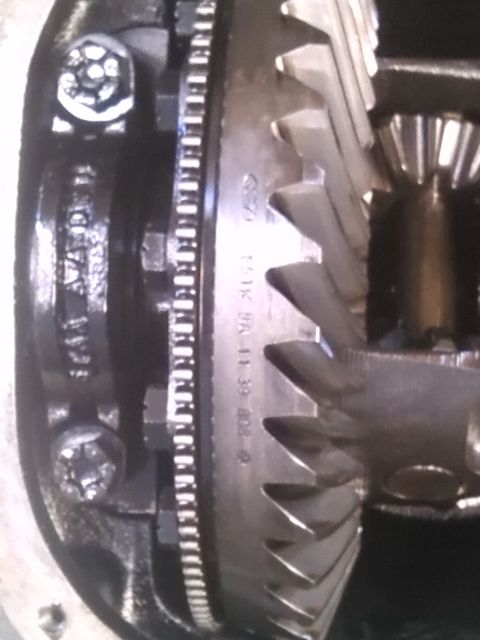 1992 Ford Bronco - Close-up view of differential gears, showing a Ford logo and part numbers stamped on the component.