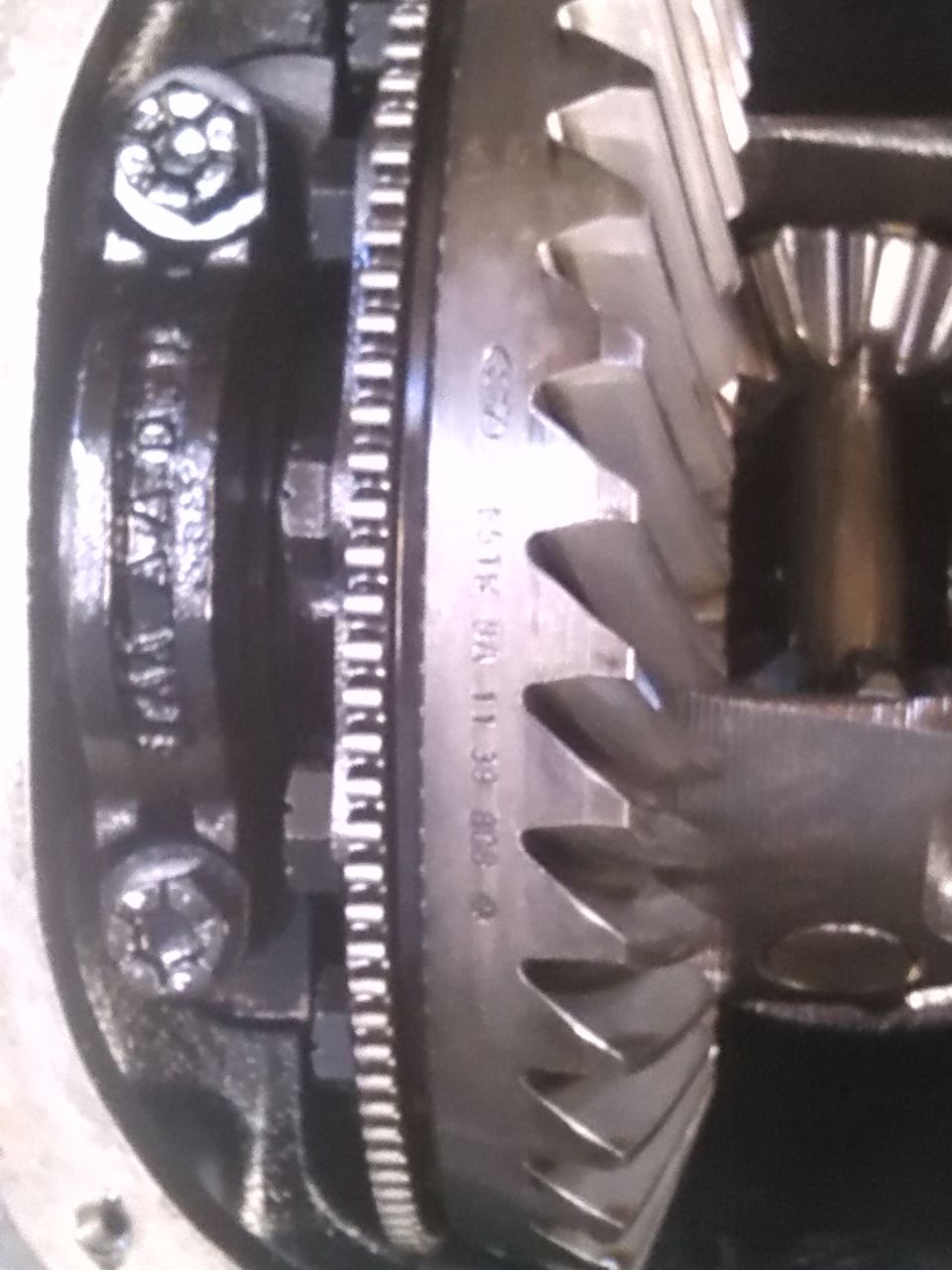Close-up of differential gears with Ford logo and part numbers visible