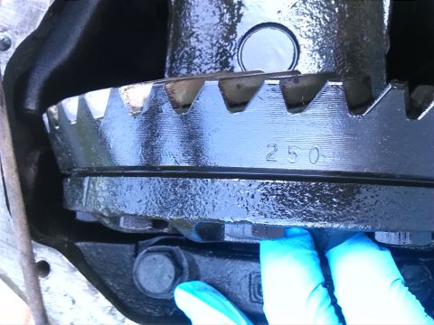 1992 Ford Bronco - A close-up view of a vehicle's differential gear, showing the number 250 stamped on its surface.