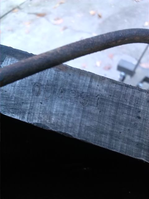 1992 Ford Bronco - A metal component displays stamped identification numbers.