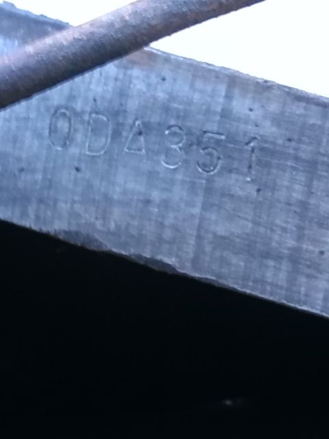 1992 Ford Bronco - Close-up of a metal part stamped with the identification numbers 0DA351.