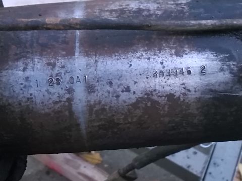 1992 Ford Bronco - Metal part shows stamped identification numbers, possibly a part number or serial number.