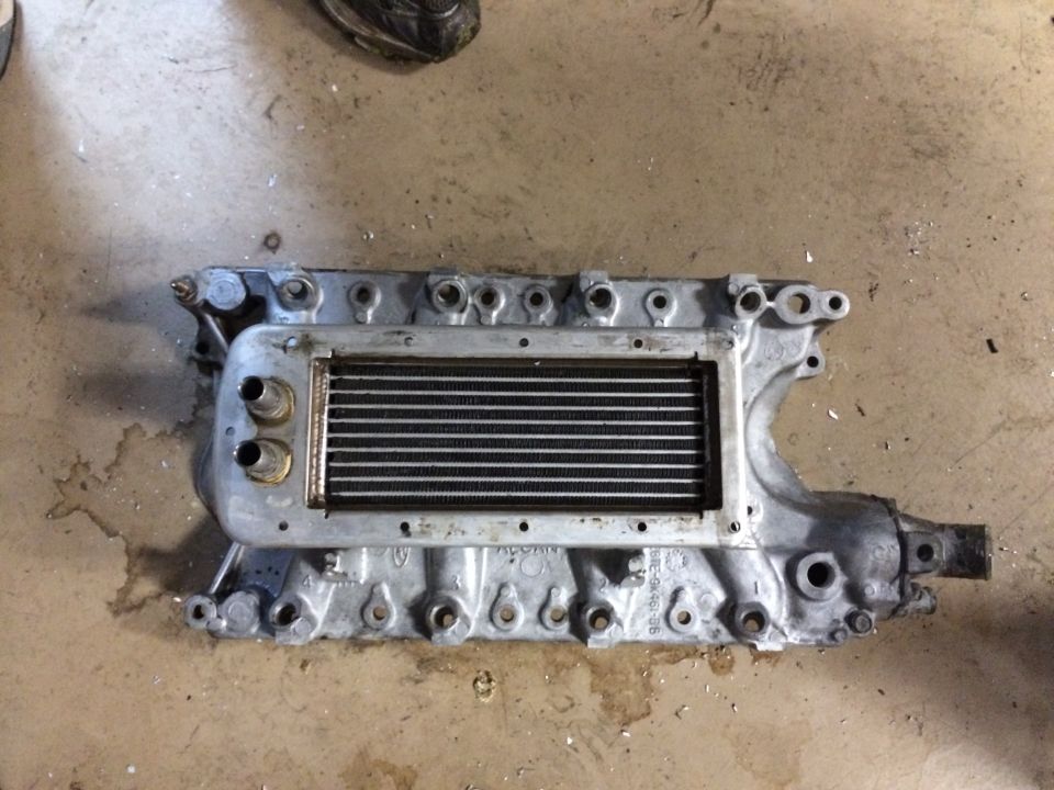 Supercharger assembly with intercooler and intake manifold