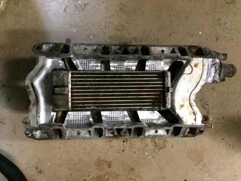1996 Ford Bronco - This is a supercharger assembly with an integrated intercooler, likely for a V8 engine.