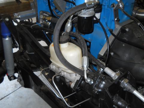1992 Ford Bronco - Close-up view of engine components including the brake master cylinder and hydraulic lines.