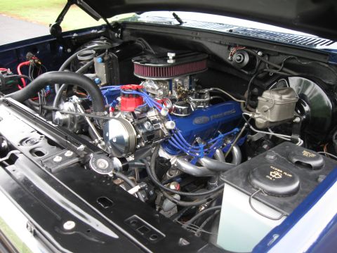 1982 Ford Bronco - Engine bay of a 1982 Ford Bronco, showing the V8 engine with performance modifications.