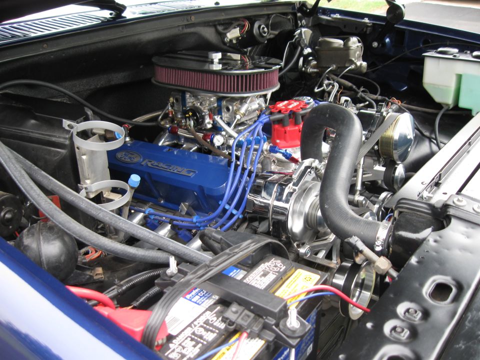 Blue Ford Racing engine with chrome accents and red air filter
