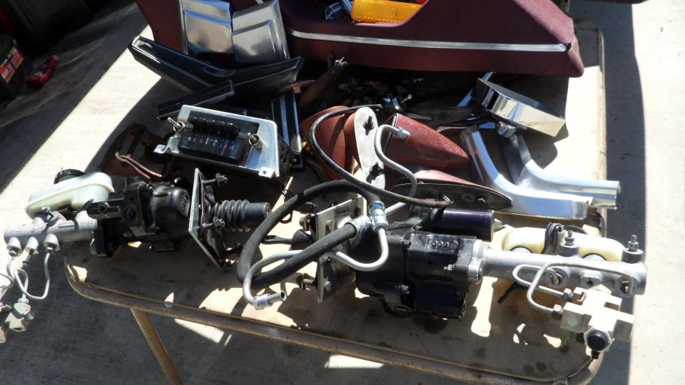 Brake booster and master cylinder assembly with various trim pieces