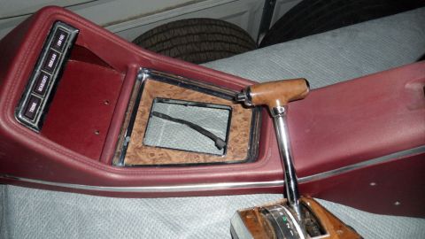 1972 Ford Ranchero - Close-up of a vehicle's interior console, a woodgrain accent and an automatic transmission shifter.