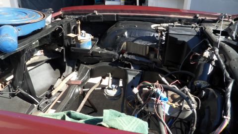 1972 Ford Ranchero - The engine bay of a 1972 Ford Ranchero shows a disassembled state with visible wiring and components.