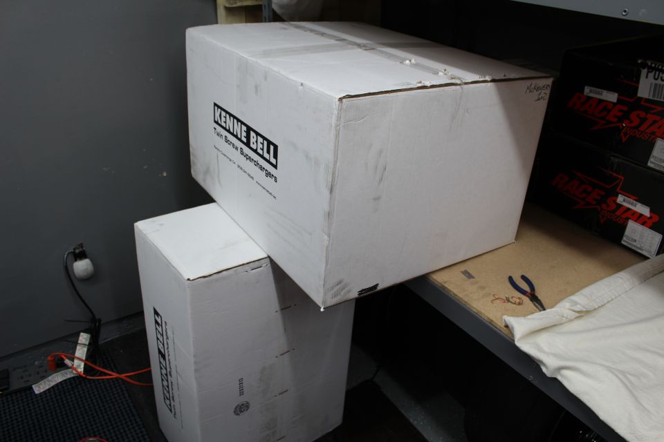 Kenne Bell labeled white box on a shelf next to Race Star boxes