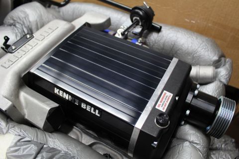 2003 Ford Crown Victoria - Kenne Bell supercharger displays its black finned lid, red oil-warning label and pulley snout atop a cast aluminum intake manifold.