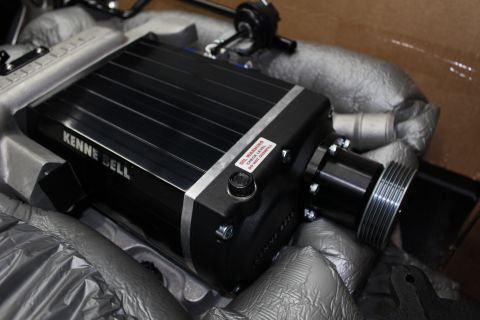 2003 Ford Crown Victoria - Kenne Bell supercharger with black lid and silver grooved pulley sits cradled in gray foam packing material.