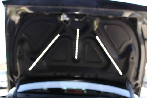 2003 Ford Crown Victoria - View of the inside of an open trunk lid fitted with three angled reflective LED light strips.