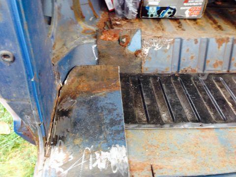 1979 Ford Bronco - Repairing rusted floor pan section on a vehicle.