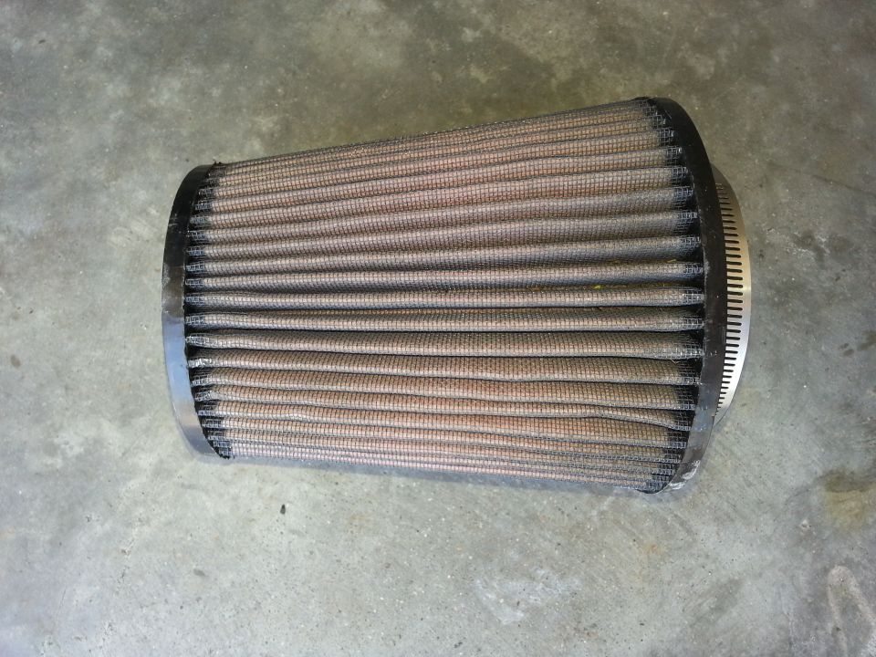 Used air filter with metal clamp