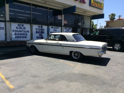 1968 Ford Mustang - A white 1963 Ford Galaxie 500 is parked in front of the Vista Mini Mart.