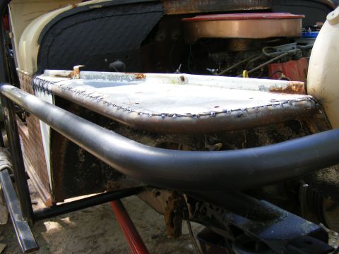 Custom roll cage and engine bay of a modified off-road vehicle