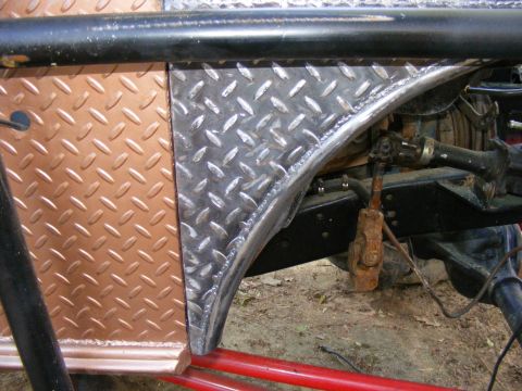 Diamond plate fender flare and suspension parts on a vehicle