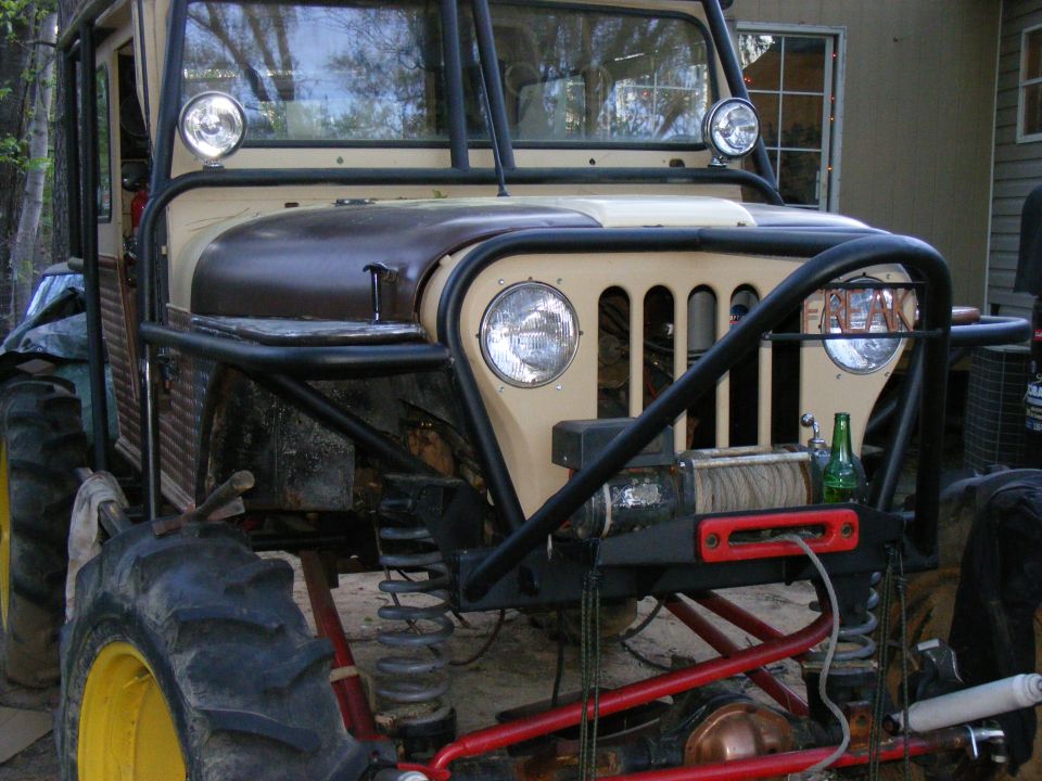 Modified off-road vehicle with large tires and winch
