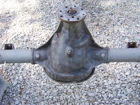 1999 Mercury Grand Marquis - A differential housing is shown from the rear, mounted on two axles.