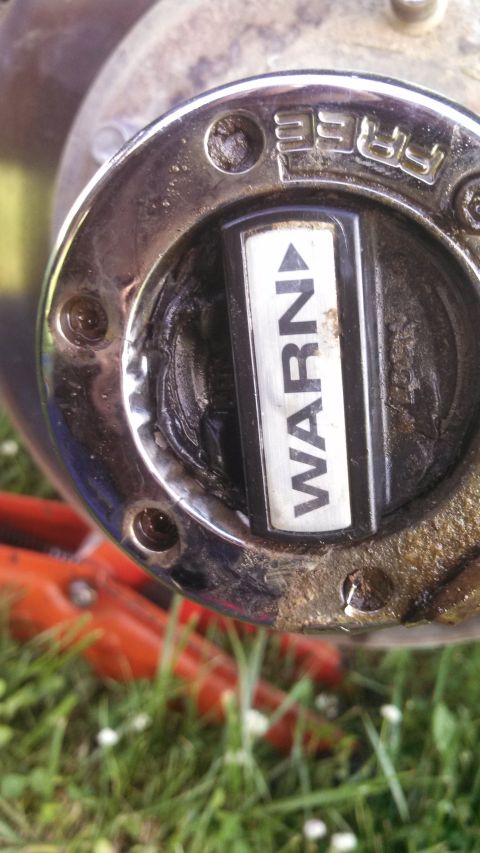 1979 Ford Bronco - This close-up shows a hubcap with "WARN" printed on it, indicating a part of a vehicle's drivetrain.