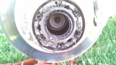 1979 Ford Bronco - The wheel hub assembly shows significant wear and corrosion on its locking mechanism.