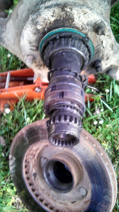 1979 Ford Bronco - Disassembled wheel hub assembly, likely for a truck or SUV, with a brake rotor visible.