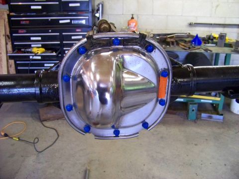 1999 Mercury Grand Marquis - Chrome differential cover with blue bolts and an orange reflector is shown installed on a rear axle.