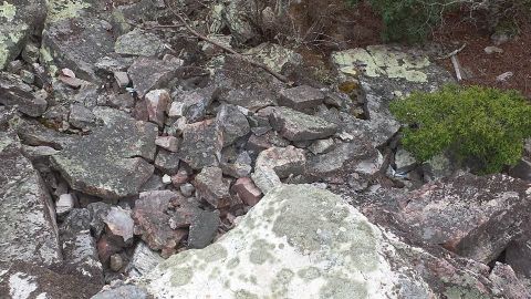 1979 Ford Bronco - A rocky landscape with sparse vegetation and no visible vehicles.