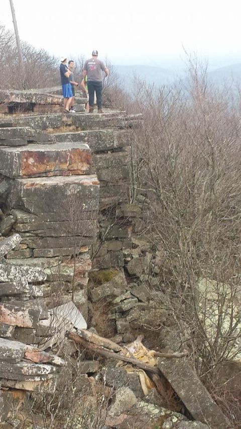 1979 Ford Bronco - People enjoying a view from a high vantage point on a rocky outcrop.