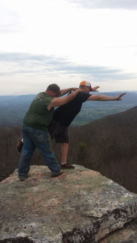 1979 Ford Bronco - Two men strike a pose on a rocky outcrop with a scenic view of the valley below.