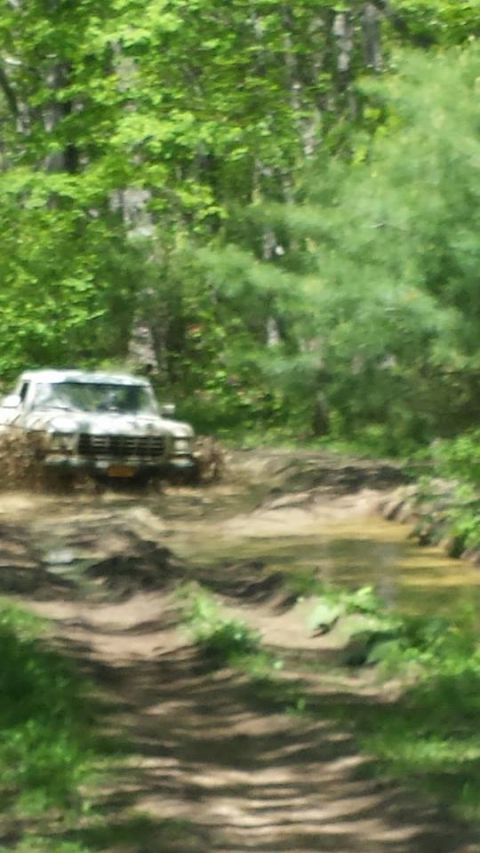 1979 Ford Bronco - This 1979 Ford Bronco is navigating a challenging muddy off-road course.