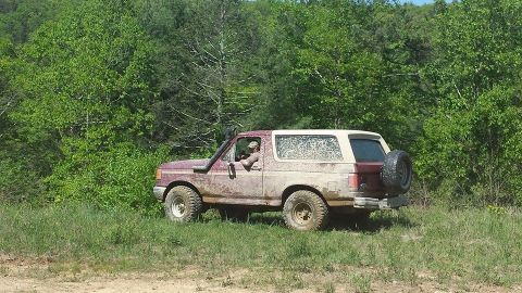 1979 Ford Bronco - This 1987 Ford Bronco is covered in mud and has a snorkel installed for off-road use.