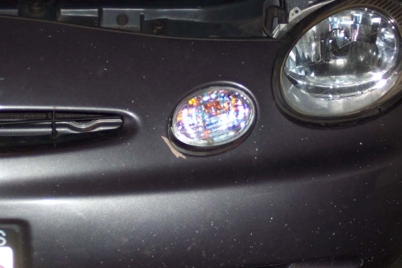 1996 Ford Taurus front bumper with headlight and fog light