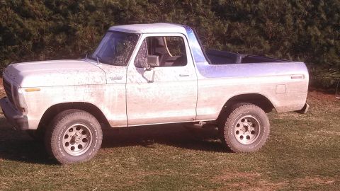 1979 Ford Bronco - This 1978 Ford Bronco is shown from the side, parked outdoors on a grassy area.