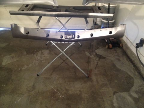 1965 Ford Mustang front bumper and hood support on stand