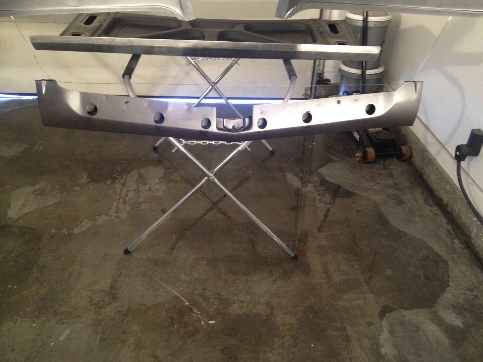 1965 Ford Mustang front bumper and hood support on stand