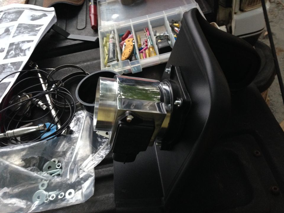 aftermarket air intake part with chrome tubing and black plastic housing