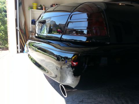 2003 Mercury Marauder - Black 2003 Mercury Marauder rear end detail, parked in a garage.