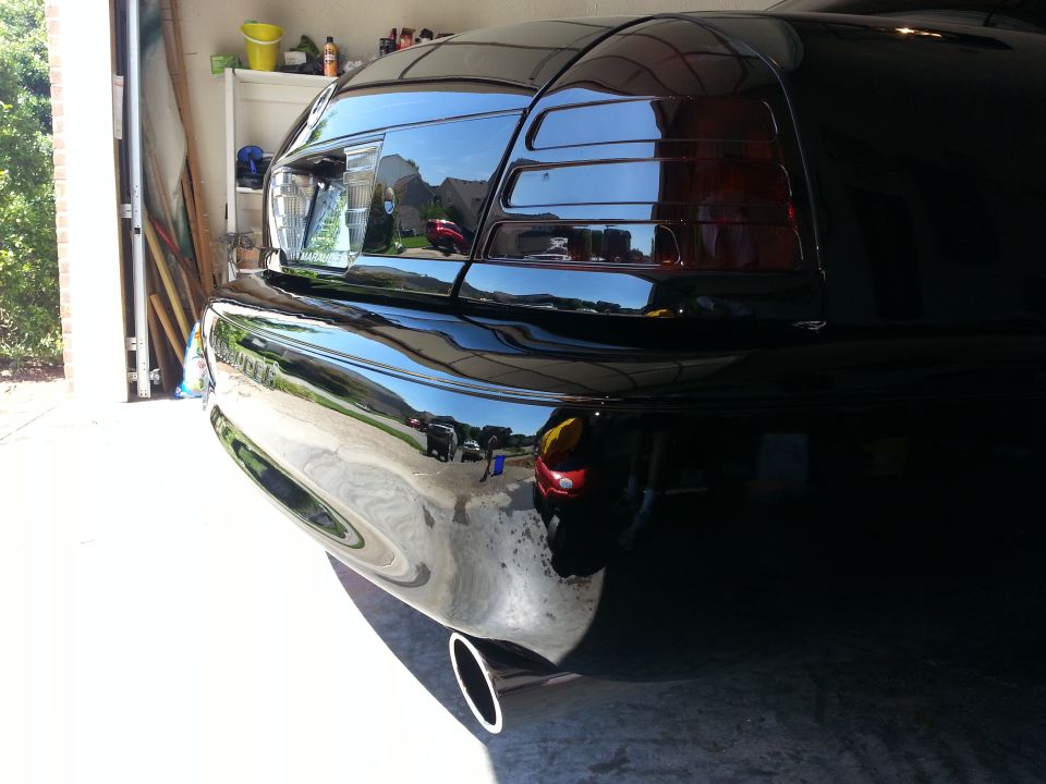 Rear view of a black 2003 Mercury Marauder showing taillight and exhaust tip