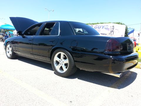 2003 Mercury Marauder - A black 2003 Mercury Marauder is parked outdoors with its hood open, showing off its engine bay.