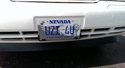 2000 Mercury Grand Marquis - Nevada license plate UZT 4U is mounted on the front bumper of a white vehicle.