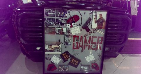 2000 Mercury Grand Marquis - A display board with movie memorabilia is attached to the front of a dark vehicle.