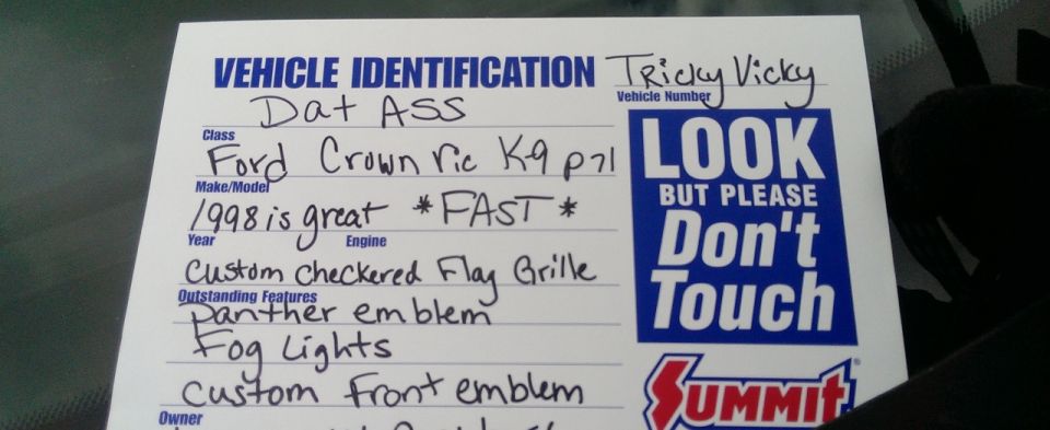 Handwritten car-show vehicle identification card on a windshield
