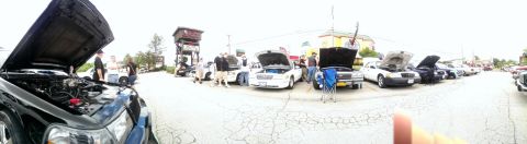 2000 Mercury Grand Marquis - A gathering of vehicles, many with their hoods raised, at an outdoor event.