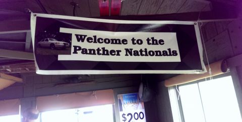 2000 Mercury Grand Marquis - A banner hangs from the ceiling, welcoming attendees to the Panther Nationals event.