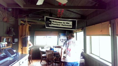 2000 Mercury Grand Marquis - An interior view shows a banner reading "Welcome to the Panther Nationals" hanging above tables and chairs.