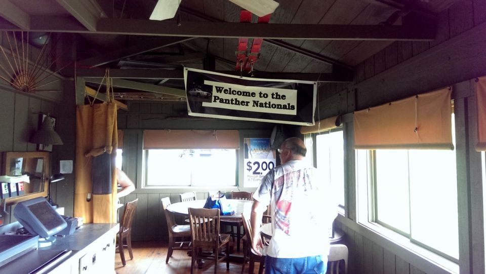 Interior scene with "Welcome to the Panther Nationals" banner