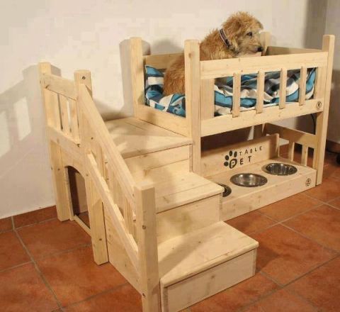 1994 Ford Bronco - A multi-level wooden dog bed includes stairs for easy access and built-in bowls for food and water.